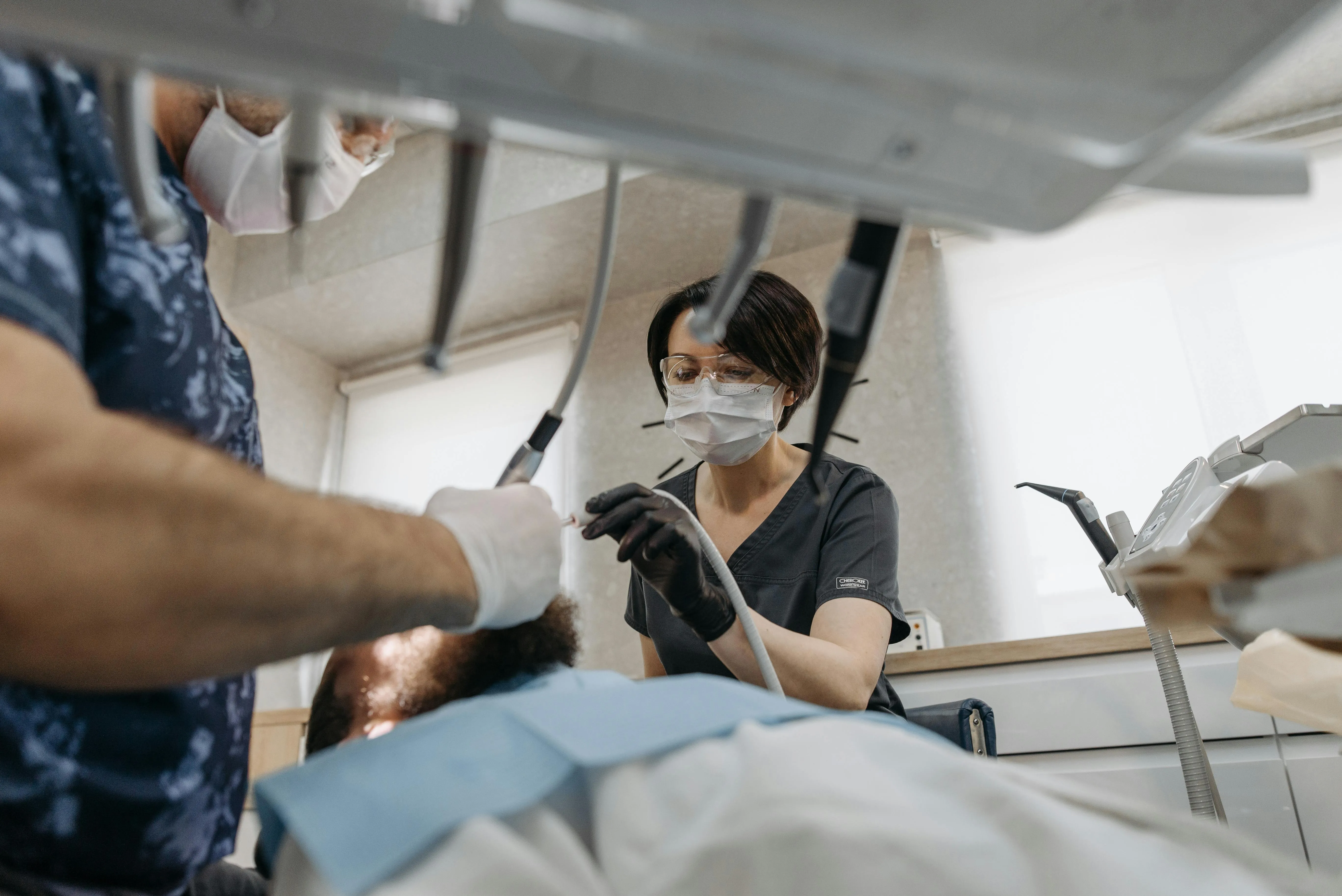 Dental team carrying out a treatment together at a partner clinic
