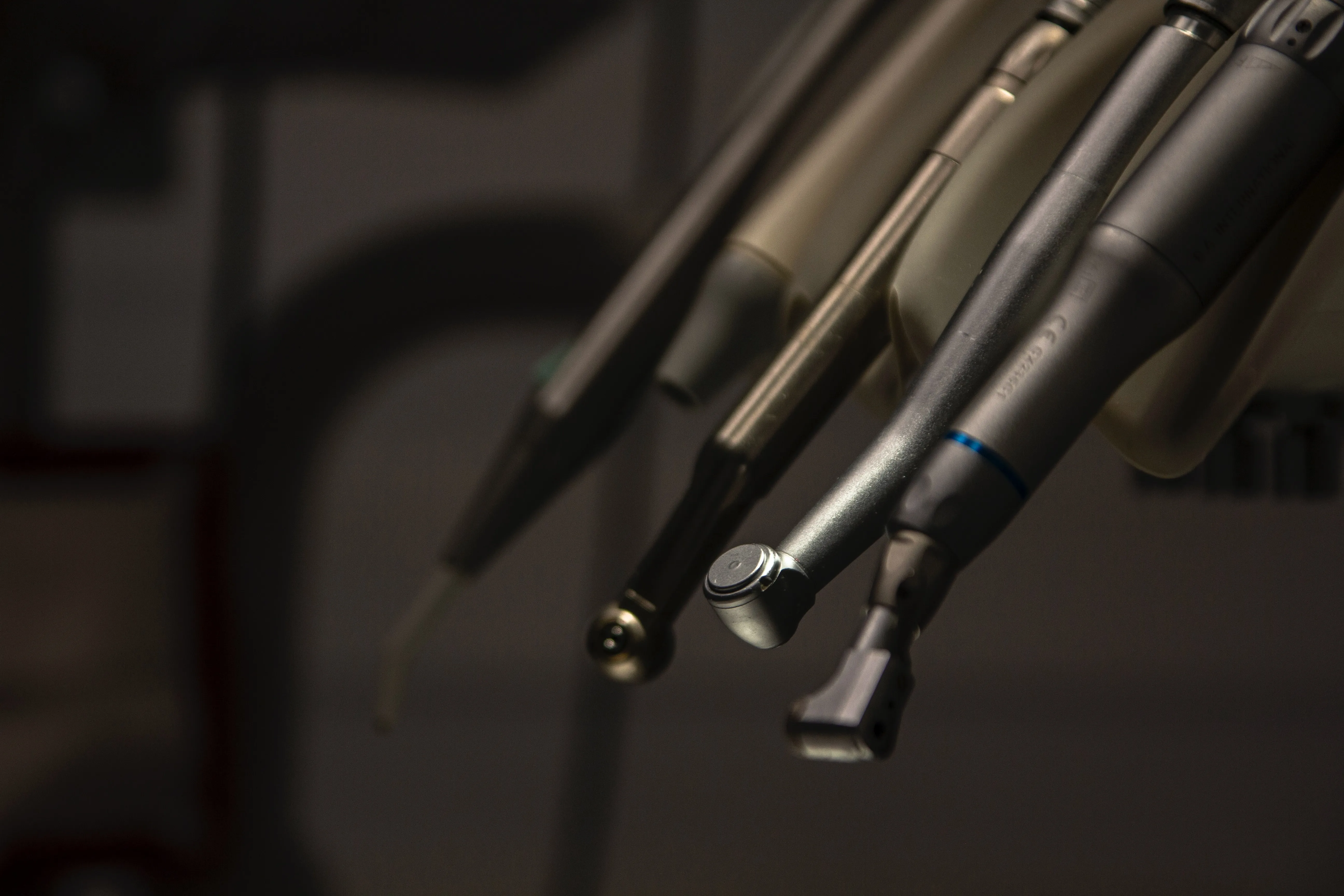 Close-up of dental handpieces and drills at a partner clinic