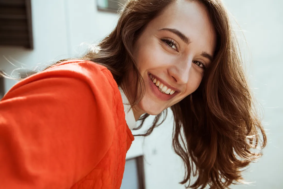 A dental professional smiling in a modern Bucharest clinic